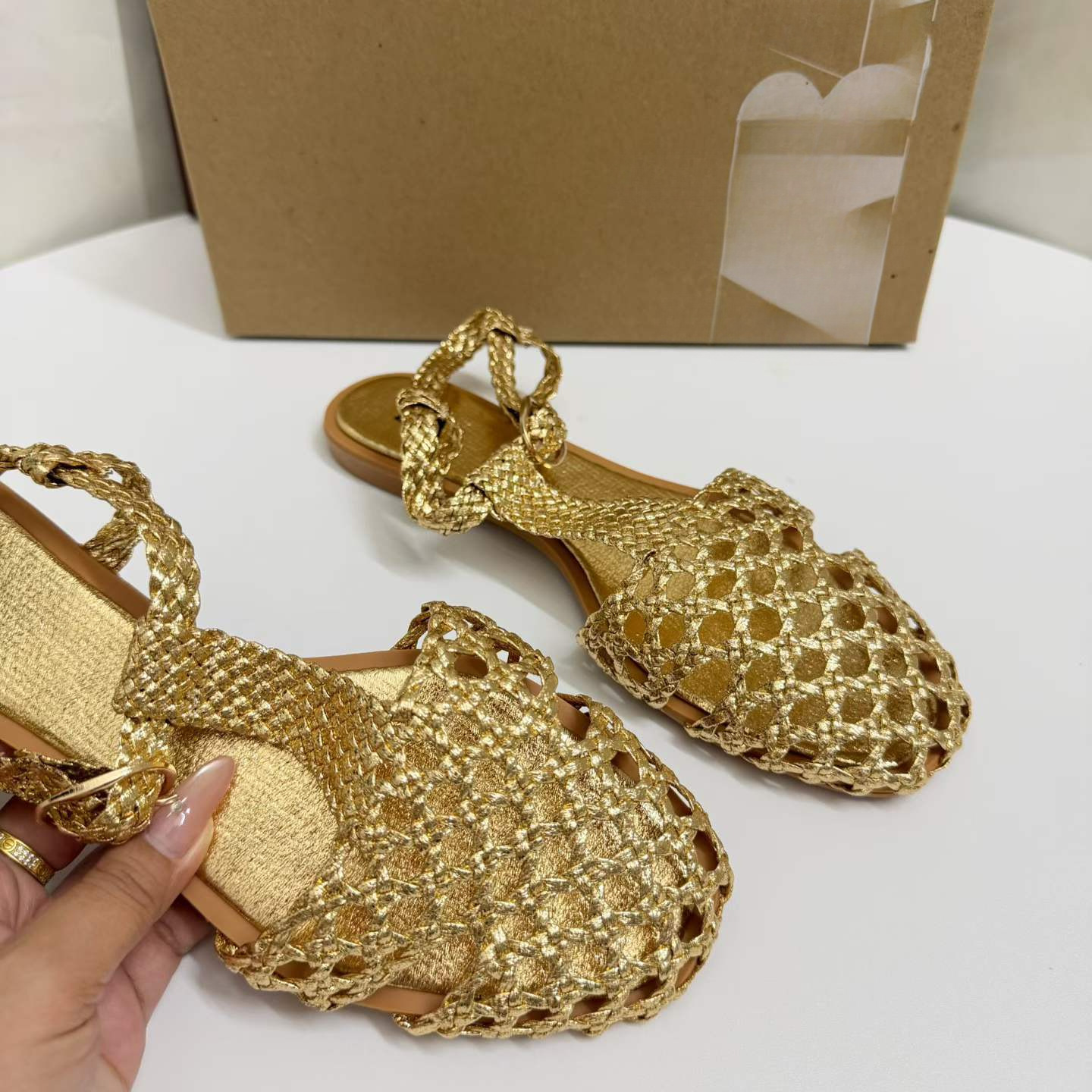JHC-HB-249 | Woven Cutout Metallic Gold Round-Toe Flat Gladiator Sandal angle 2