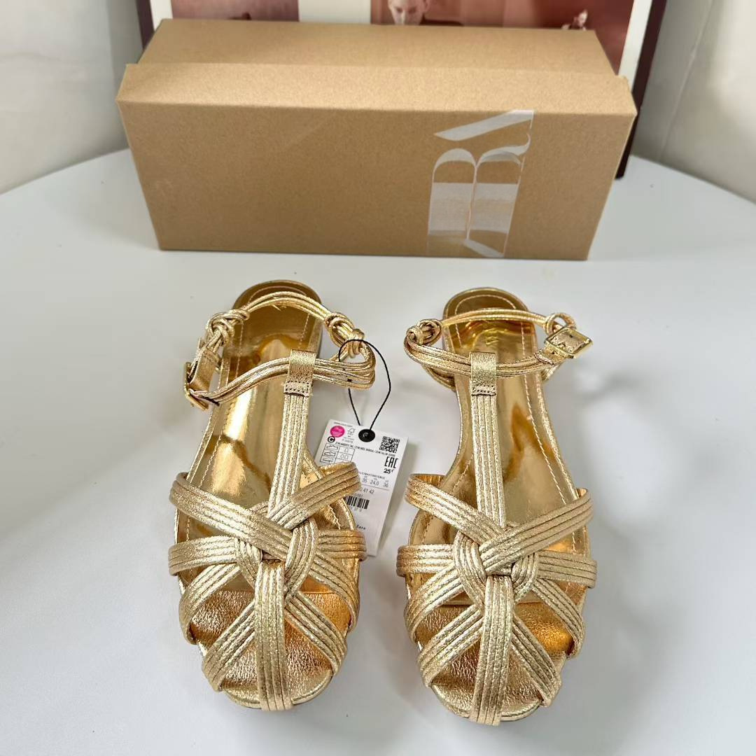 JHC-HB-034 | Woven Cutout Metallic Gold Round-Toe Flat Gladiator Sandal angle 2
